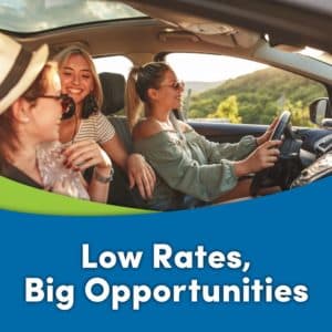 Group of woman having fun in car on road trip with headline, "Low Rates, Big Opportunities"