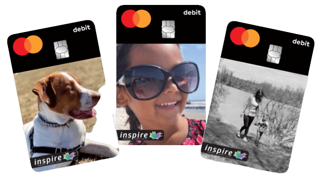 Personalized Inspire FCU debit cards with pictures of family and pets on the front