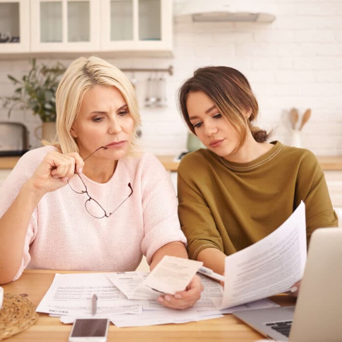 Women reviewing finances at home after refinancing his auto loan with Inspire Federal Credit Union in Bensalem, PA